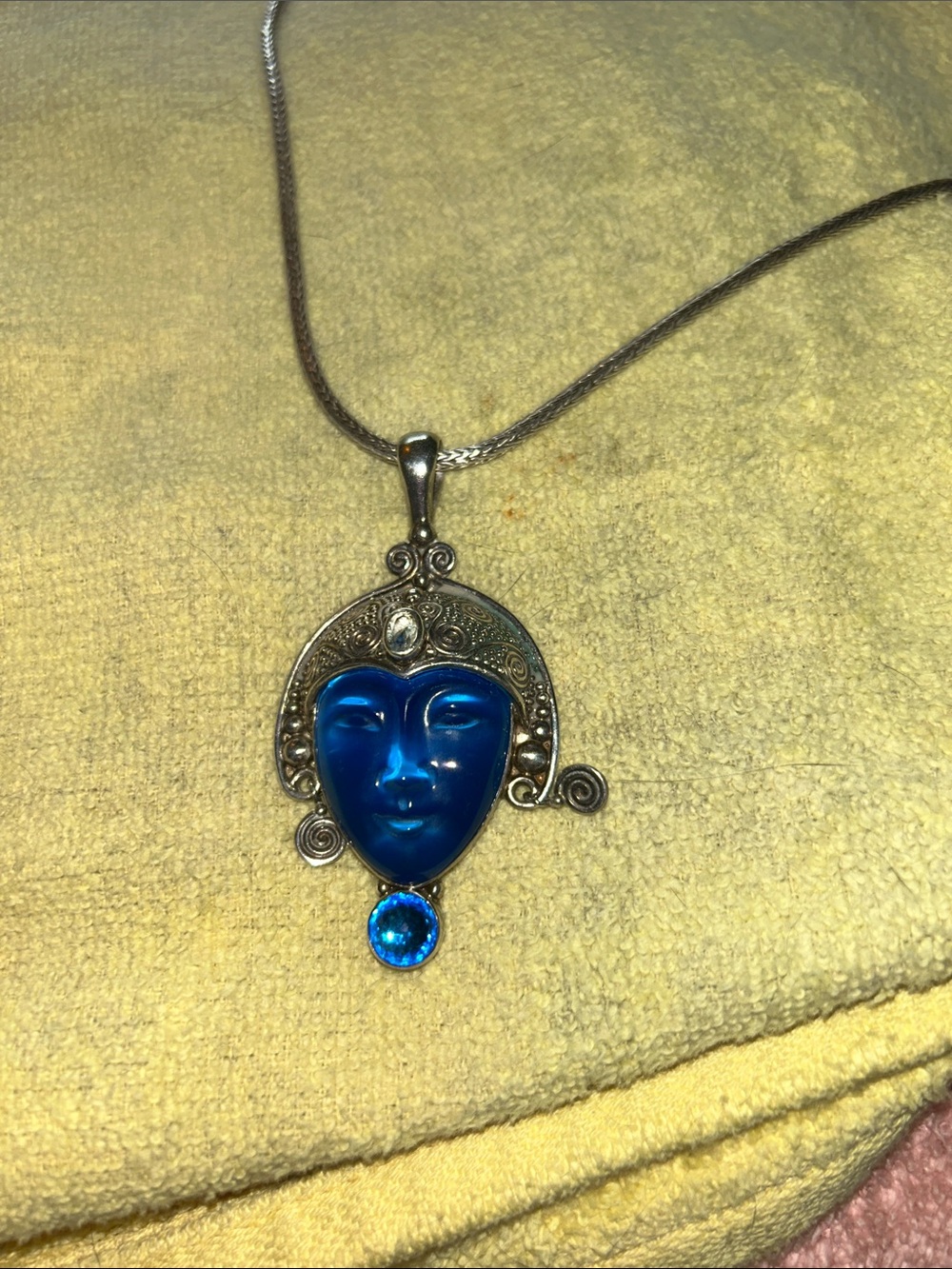 Dark blue carved prince face with accent stones. NOVICA from Bali